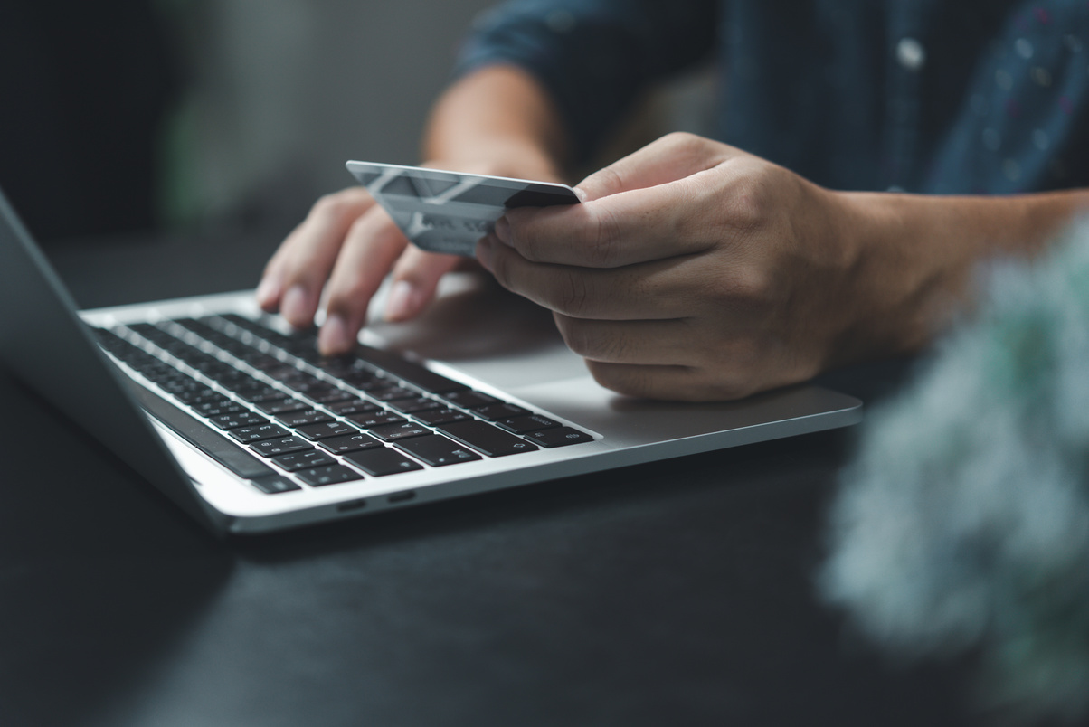Man holding credit card payment wallet technology digital online shopping e commerce business finance.